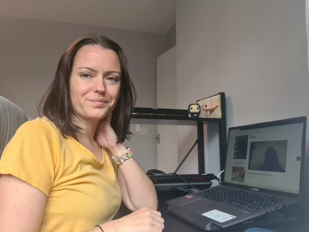 Sahara Fleetwood-Beresford at her desk writing about Disability Employment Awareness Month