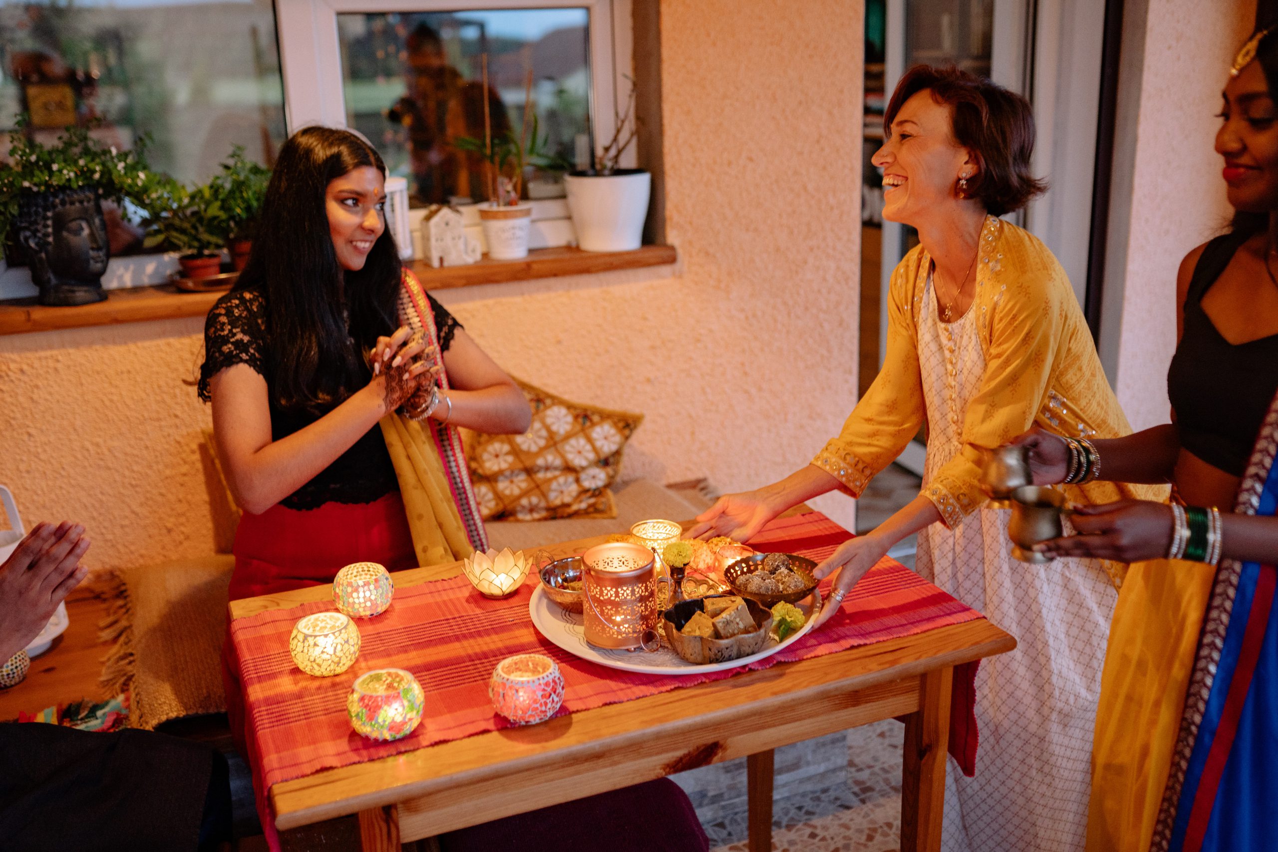 Family celebrating Diwali with lights and food