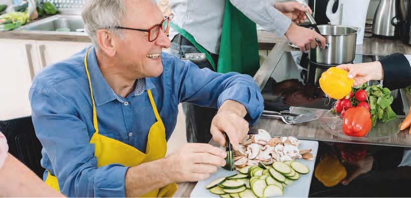 Man chopping veg