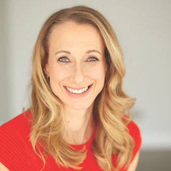Jo Prance in red t-shirt smiling to camera