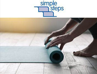 Person rolling up a yoga mat