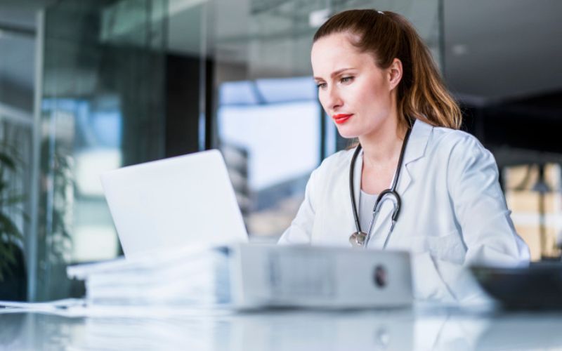 A nurse reviewing prescriptions